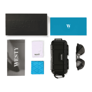 A neatly arranged display features a black box labeled "WESTY," a blue envelope with a white "W," a black protective case, sunglasses, and four cloth pieces in various colors and patterns, including one gray, one teal, one white with "WESTY," and one blue with a geometric design.